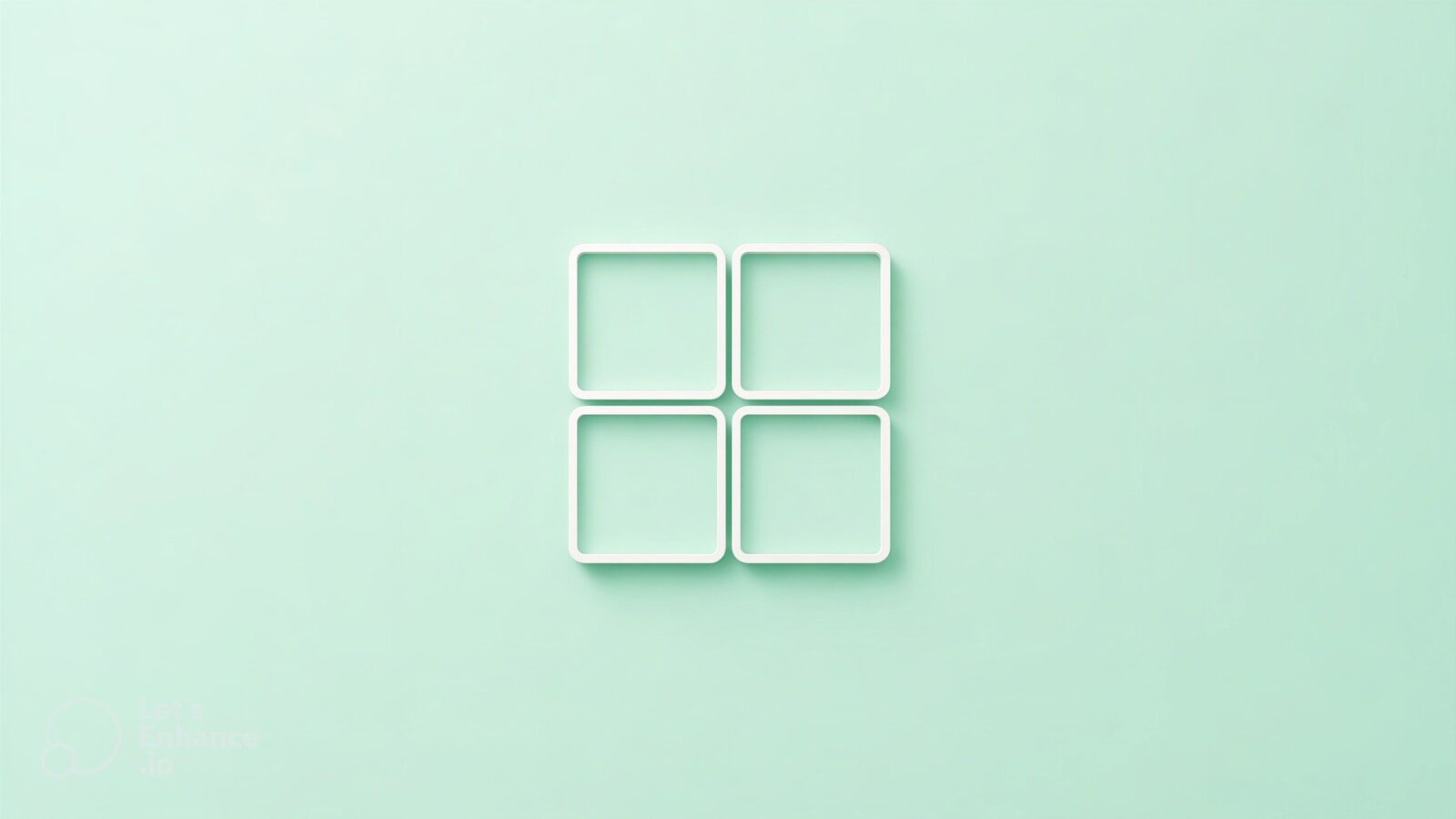 Four white squares arranged in a grid on mint background